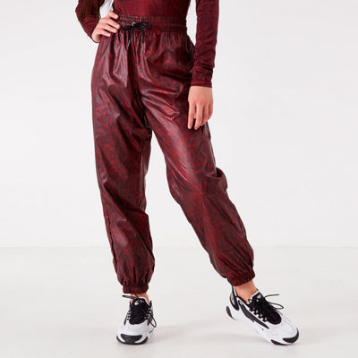 Nike Python Print Woven Pants In Red 