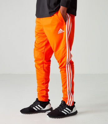 orange and white adidas pants